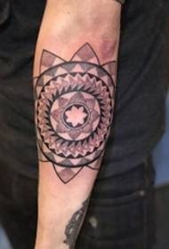 Beautiful stinging style mandala pattern tattoo on the forearm