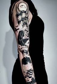 Gambar tato potret stereo ireng ing lengen