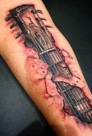 Incredibile modello di tatuaggio per braccio color chitarra strappato