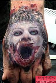 a clown portrait tattoo pattern on the back of the hand