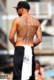 Lewis Hamilton derrière le motif de tatouage Christ
