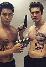 Dragon and tiger tattoo pattern on handsome male star
