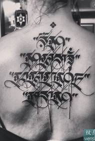 Gyönyörű szanszkrit tetoválás mintázat a titokzatos szöveg mögött