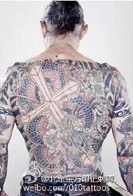 Patrón de tatuaxe dominante con tótem