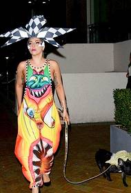 Lady Gaga wearing alien pattern jumpsuit wearing exaggerated headwear show new tattoo