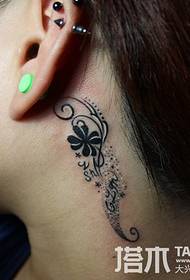 Small fresh tattoos behind the ear