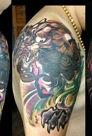 Cool classic Tang lion tattoo pattern on male arm shoulders