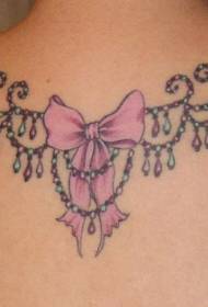 Γυναικείο πίσω πολύχρωμο τόξο και διακοσμητικές εικόνες τατουάζ