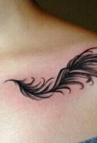 Elegant shoulder feather tattoo