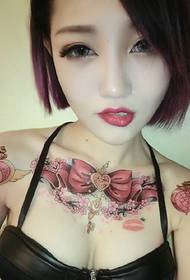 Fashion beauty has a beautiful totem tattoo on the chest
