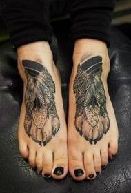 Piedi di mudellu di tatuaggio di pata di lupu di piuma neru