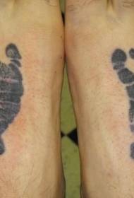 Tatuatge de petjada de bebè negre a l’inici