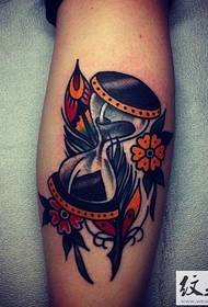 Colourful hourglass muenzaniso tattoo