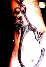 Feet bare black brown lizard crawling skin tattoo