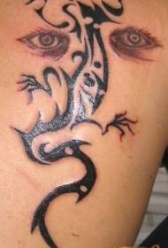 lagarto tribal negro de ombreiro con tatuaxe de ollos