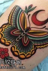 Colored butterfly tattoo pattern on thigh