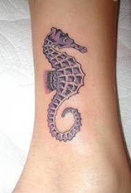 Simple hippocampus tattoo on the legs