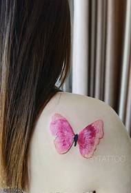 a painted butterfly tattoo on the shoulder