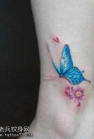 Patrún beag tattoo féileacán ar na cosa