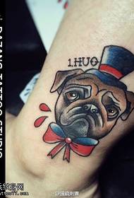 a gentleman's dog tattoo pattern on the ankle