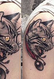 a cat tattoo on the shoulder
