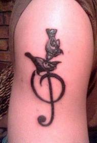Stor arm fugl og musikknoter svart tatoveringsmønster