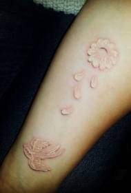 White bird and flower arm tattoo pattern