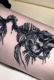 Gyönyörű fekete metszet stílusú halcsont tetoválás a lábán