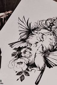 Ang sumbanan sa Manuscript wreath bird tattoo