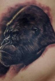 Sunkus juodo rašalo „gorilla“ tatuiruotės raštas ties juosmeniu