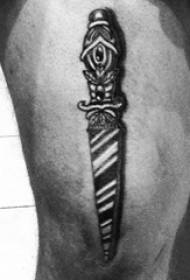 Ragazzo cosce su punto nero spina linea semplice pianta e pugnale tatuaggio immagine