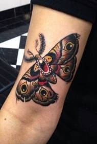 女性の腕の色mothのタトゥーパターン