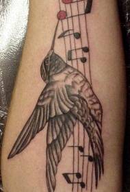 Arm gray musical notes and hummingbird tattoo pattern