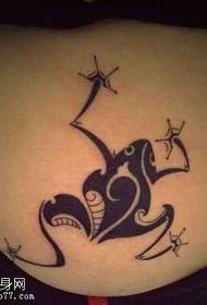 a totem frog tattoo pattern at the waist