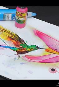 I-Watercolor splashing hummingbird flower tattoo iphethini ngesandla