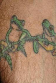 Frog tattoo on the branch