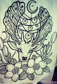 Снимка на ръкопис на татуировка на цветя на антилопа