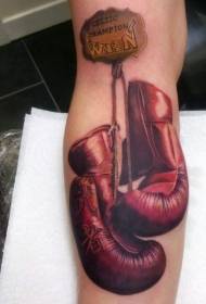 arm herdenkingsmunten gekleurde bokshandschoenen en lettertattoopatroon