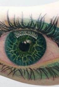 可愛逼真的綠色化妝眼手臂紋身圖案