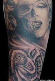 arm incredible Marilyn Monroe portrait combined with skull tattoo pattern