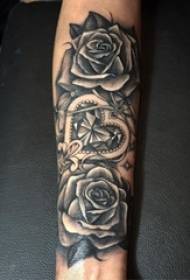 Boy's arm on black thorn plant flower rose tattoo picture