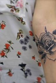 Girl's arm on black sting simple line literary plant flower tattoo picture