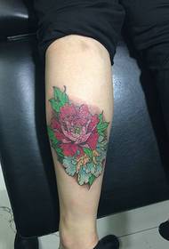 Peony eye-catching tattoo on the calf