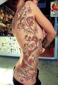 Costillas laterales de niña hermosa vid con patrón de tatuaje floral