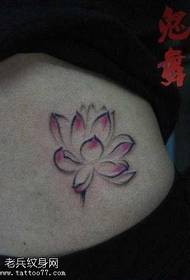 Beautiful ink lotus tattoo pattern at the waist