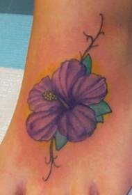 a purple flower tattoo pattern on the instep