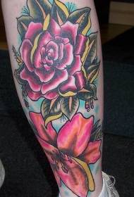 Tatuaxe de lirio en cor de pernas e rosa
