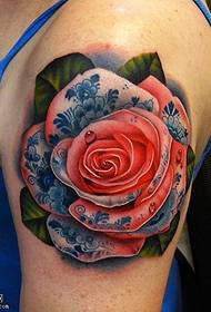 Different rose tattoos on the shoulders
