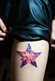 A lotus tattoo surrounded by a five-pointed star shines