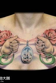 Chest rose tattoo